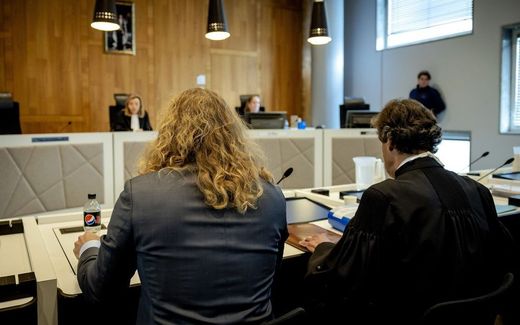 The sperm donor Jonathan M. (left) seen on his back, together with his lawyer in court in The Hague. Photo ANP, Robin van Lonkhuijsen