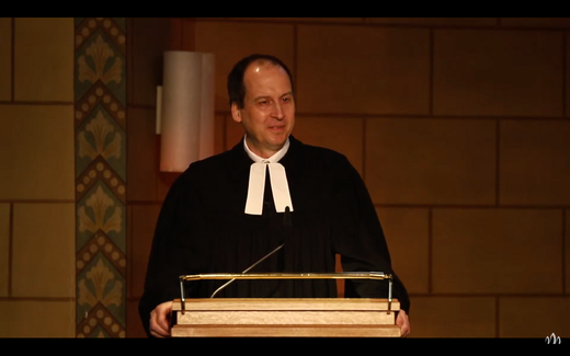 Pastor Marcus Piehl in the pulpit. Still from video YouTube