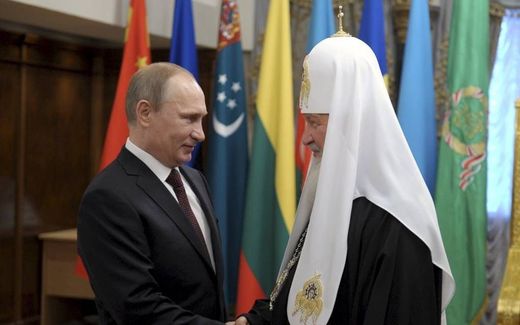 Patriarch Kirill (right) is the voice of President Putin, the editor of Orthodox Times says. Photo EPA