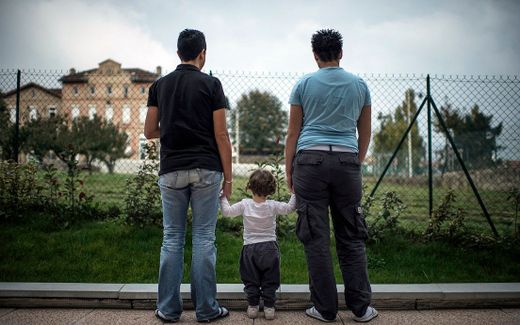 Homosexual couple with child (not related to the article). Photo AFP, Jeff Pachoud