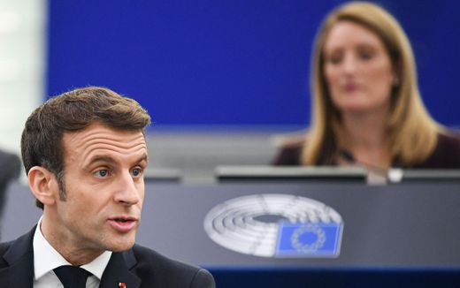President Macron speaking in the European Parliament, with Mrs Metsola in the chair behind him. Photo AFP, Bertrand Guay