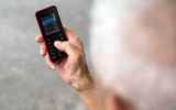 An elderly person with his phone. Lonely people can contact the Lutheran Church in Finland for a conversation. Photo AFP, Toh Ting Wei