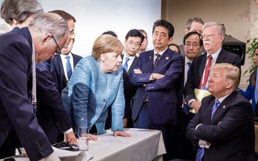 Merkel (centre) in the midst of other world leaders at the G7 in 2018. Photo AFP, Jesco Denzel