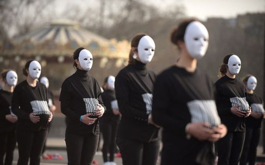 Members of a conservative activist group stage a protest against surrogacy near the Eiffel Tower in Paris. Photo AFP, Julien de Rosa