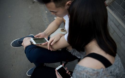 Excessive phone use cannot be seen as an exclusive cause of marital problems, the researchers write. Instead, it may be an indicator of a marriage that is unhappy already. Photo AFP, Nicolas Asfouri