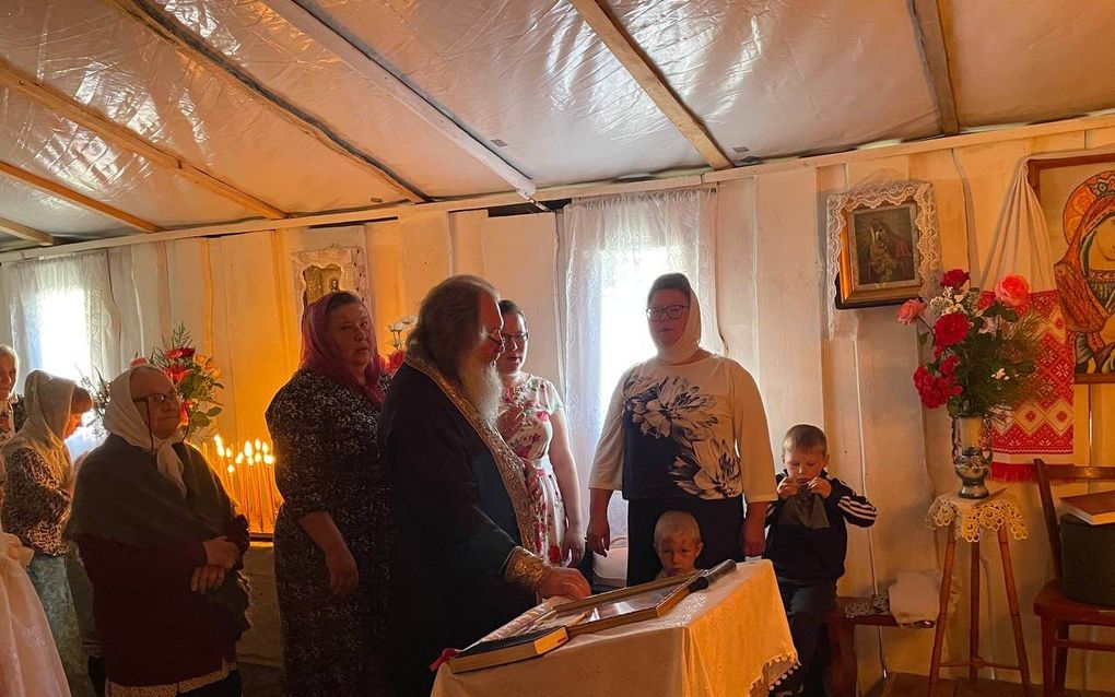 UOC parish holds church service in tent after its building was seized  
