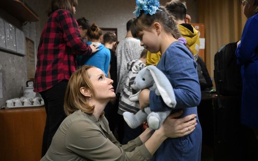 Children's Ombudswoman Maria Lvova-Belova from Russia with a child from Ukraine. Photo Telegram, Maria Lvova-Belova