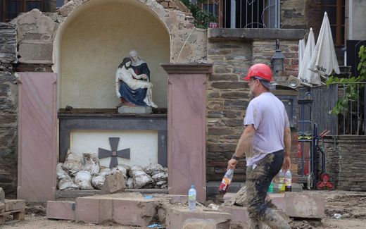 A view of a damaged shrine showing an icon of Mary and Jesus after the flooding of the Ahr River, in Mayschoss in the district of Ahrweiler, Germany. photo EPA, Friedemann Vogel
