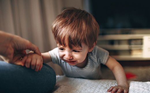 Young child about to throw a tantrum. Photo Unsplash,  Helena Lopes 