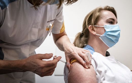 Nurse receiving a vaccination. In France, the health authority wants to fire all healthcare personnel that does not get their measles vaccination. Photo ANP, Rob Engelaar