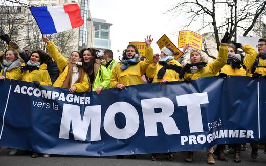 The end-of-life issue is very sensitive in France. Demonstrators hold a banner reading "end of life care, not planned death" during a March for Life. Photo AFP, Julien de Rosa