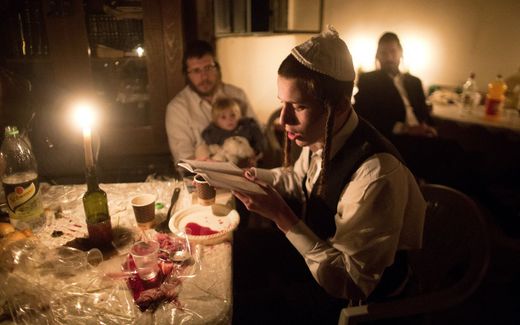 Ultra-orthodox Jewish men share a candle light diner to celebrate the Jewish ritual of "Sheva Brachot" (the seven blessings), also known as the wedding blessings. Photo AFP, Menahem Kahana

