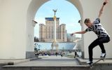 A boy jumps on his skateboard on spring day in the centre of Kiev. Photo AFP, Sergei Supinsky