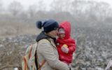 A Ukrainian mother holds her baby as she passes through the border crossing of Siret, northern Romania. Photo not related to the article. Photo EPA, Robert Ghement