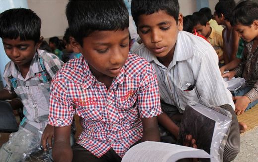 Children receive a new Bible. Photo United Bible Societies