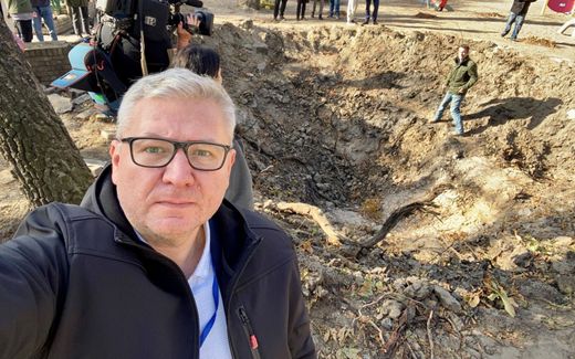 Sergei Nakul at the spot where a playground used to be before it was hit by a Russian missile. Photo Sergei Nakul 