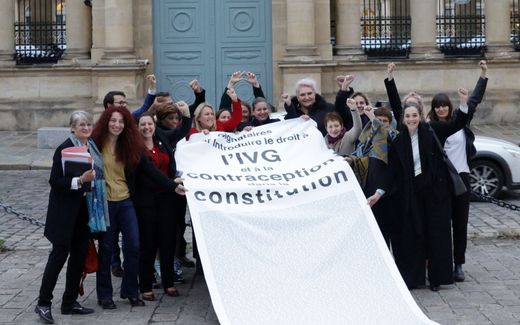 Members of the far-left party La France celebrate the fact that a majority of the French Parliament voted for enshrining the right to abortion in the Constitution. Photo AFP, Geoffrey Van der Hasselt