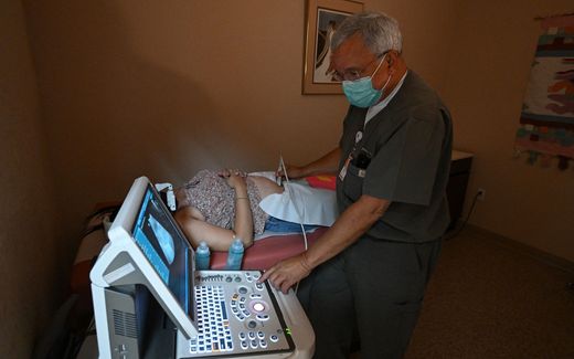 Physician performing a sonogram to confirm pregnancy on a patient seeking abortion services. Photo AFP, Robyn Beck 