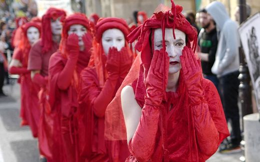 Activists of Extinction Rebellion during another act in Paris, France, during this weekend. Photo AFP, Ludovic Marin