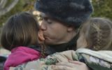 A Russian conscript bids farewell to his family before he leaves to serve in the army at a railway station. Photo EPA, Stringer