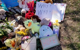 Messages and items are left at a makeshift memorial outside the entrance to the Covenant Presbyterian Church, the site of a school shooting in Nashville. Photo EPA Justin Renfroe
