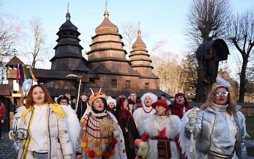 People dressed in costumes sing carols as they take part in Orthodox Christmas celebrations in the western Ukrainian city of Lviv on January 7. Photo AFP, Yuriy Dyachyshyn