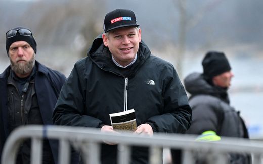 The leader of the far-right Danish political party Stram Kurs, Swedish-Danish politician Rasmus Paludan is pictured while holding an edition of The Quran (Koran), the central religious text of Islam, while staging a protest outside the Turkish Embassy in Stockholm, Sweden. Photo AFP, Fredrik Sandberg
