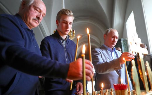 President Lukashenko (left) with his son Nikolai (middle) and President Putin (right) in 2019 in Russia in a cathedral. Photo EPA, Michael Klimentyev