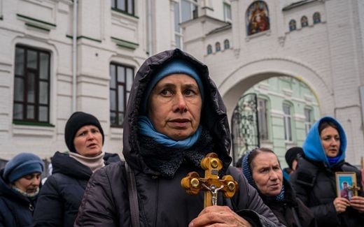 Believers of the Ukrainian Orthodox Church (UOC) pray outside the historic Kyiv-Pechersk Lavra monastery. The government is in a fight with the church about the Lavra complex in the capital. Photo AFP, Dimitar Dilkoff
