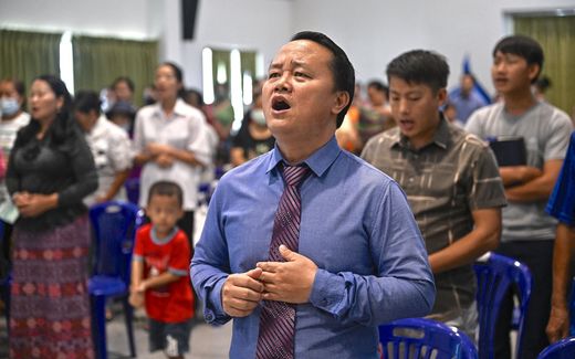 Singing in a Hmong church in Bangkok. Photo AFP, Lillian Suwanrumpha