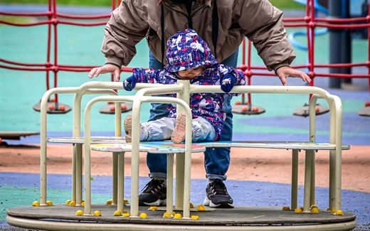 A mother plays with her child at a park. Photo AFP, Yuri Kadobnov