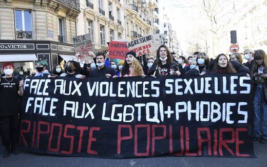 Protesters hold a banner reading 'face to the sexual violences, to the phobia of the LGBTQI - abbreviation for lesbian, gay, bisexual, transgender, and queer (or questioning)' during a demonstration called by Feminist Strike Movement. Photo AFP, Bertrand Guay
