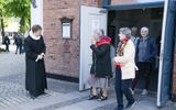 Pastor Lars Gustav Lindhardt (L) of the Evangelical Lutheran Church in Denmark bids farewell to churchgoers following a service at the Frederiksberg Church in Copenhagen. Some researchers criticise the suspected relationship between health and religion, because they believe that the concept of community is more important than the religion itself when it comes ot health. Photo EPA, Claus Bech 