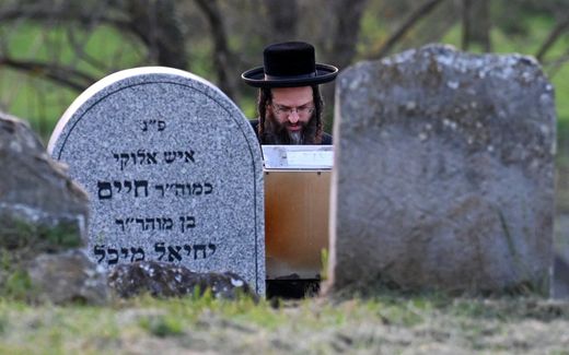 A Hasidic Jewish pilgrim prays close to the grave of late miracle rabbi Yeshaya Steiner, also known as Rebbe Shaya’le. Photo AFP, Attila Kisbenedek

