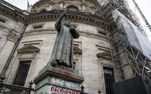 A statue of the Danish-Norwegian Lutheran missionary Hans Egede exposed outside the Frederik's Church, vandalized during the night in Copenhagen, Denmark. Hans Egede was a missionary in Greenland in the 18th century and a colonizer among the local population. Photo AFP, Liselotte Sabroe
