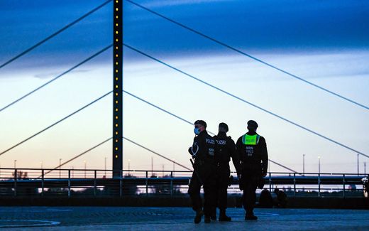 German police officers patrol at the Rhine promenade. photo AFP, Ina Fassbender