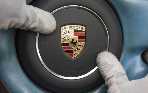 The Porsche logo is fixed on the steering wheel of a Porsche sports car on the production line of German carmaker Porsche AG at the company's factory site in Stuttgart, southwestern Germany. Photo AFP, Thomas Kienzle
