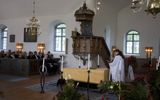 Faro priest Agneta Soderdahl, right, leads a funeral ceremony in Sweden. Photo EPA, Bengt Wanselius
