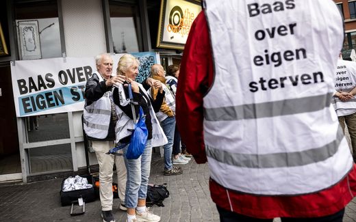 Demonstrants show support to Alex S. who was found guilty of assisting others in committing suicide. He sold poisonous drugs to people with a death wish. This is illegal in the Netherlands. The banners read "Boss over own life". Photo ANP, Rob Engelaar
