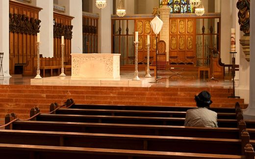 Lonely churchgoer in Germany. Photo AFP, Christof Stache
