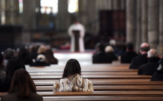A woman attends a mass at the Cathedral in Cologne. Photo AFP, Ina Fassbender