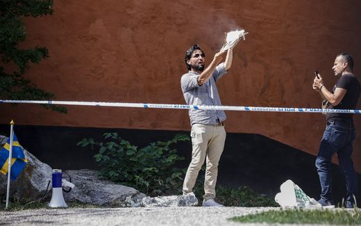 Salwan Momika, an Iraqi man, sets a copy of the Koran on fire outside a mosque in Stockholm, Sweden. Photo EPA, Stefan Jerrevang 