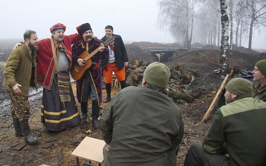 A group of Performing Artists visit National Guard soldiers on Christmas Eve (December 24) at their position not far from the Russian border near Kharkiv, Ukraine. Photo EPA, Sergey Kozlov