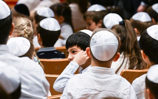 Students attend the celebrations of the Hanukkah festival at the Jewish elementary school 'Heinz Galinski school' in Berlin. Photo EPA, Filip Singer