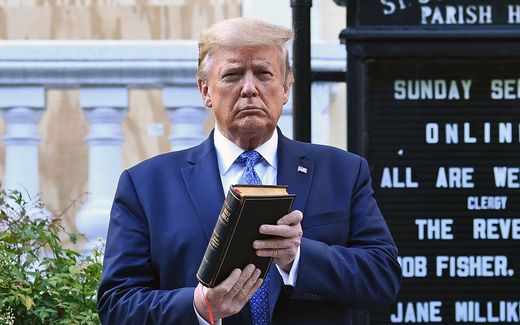 Donald Trump holds up a Bible outside of St John's Episcopal church. Hope cannot be found in a Presidential candidate or in other politicians, but only in the Word of God, Carl Trueman believes. Photo Brendan Smialowski