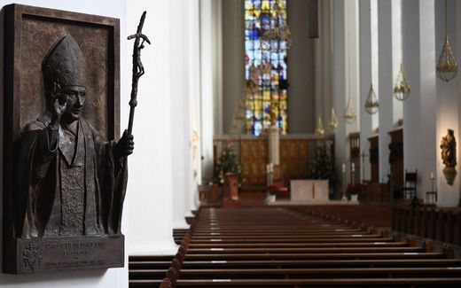 A relief of Pope emeritus Benedict XVI is displayed inside the Church of our Lady in Munich. Photo EPA, Philipp Guelland