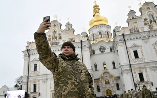 A Ukrainian serviceman takes a selfie before going into the Christmas service in the world-famous Lavra in Kyiv. Until recently, this complex was used by the Ukrainian Orthodox Church. But since this year, the church is in use by the new Orthodox Church of Ukraine. Photo AFP, Genya Savilov