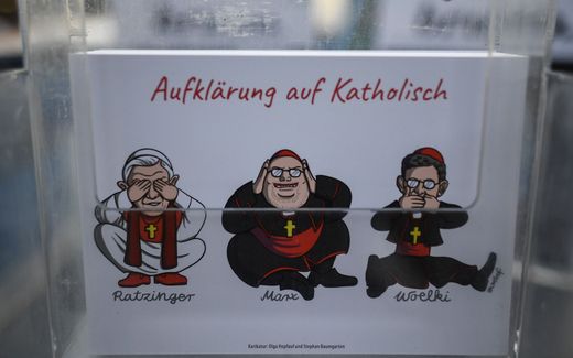 Catholic Enlightenment. Criticism on the church on a cartoon postcard. Photo EPA, Philipp Guelland