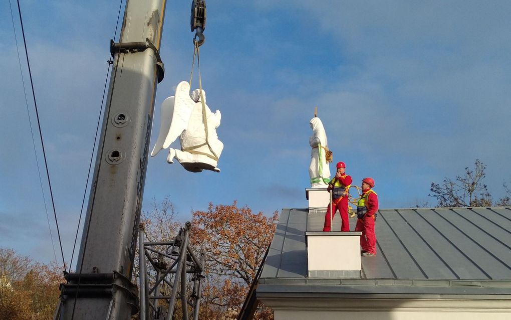 Protestant church in Lithuania installs restored sculptures after 73-year hiatus 