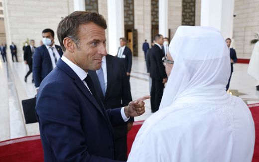French President Emmanuel Macron (L) talks with Imam of the Great Mosque of Algiers Mohamed Mamoun El-Kacimi El-Hassani during the visit of the Great Mosque of Algiers, on August 26, 2022. Photo AFP, Ludovic Marin